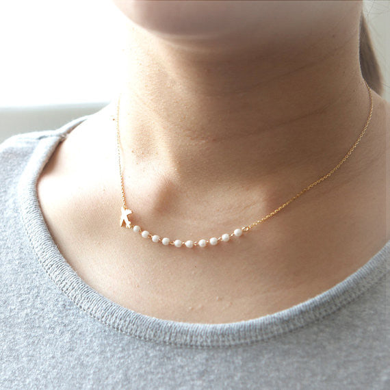 Airplane and pearls Necklace in gold