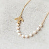 Airplane and pearls Necklace in gold